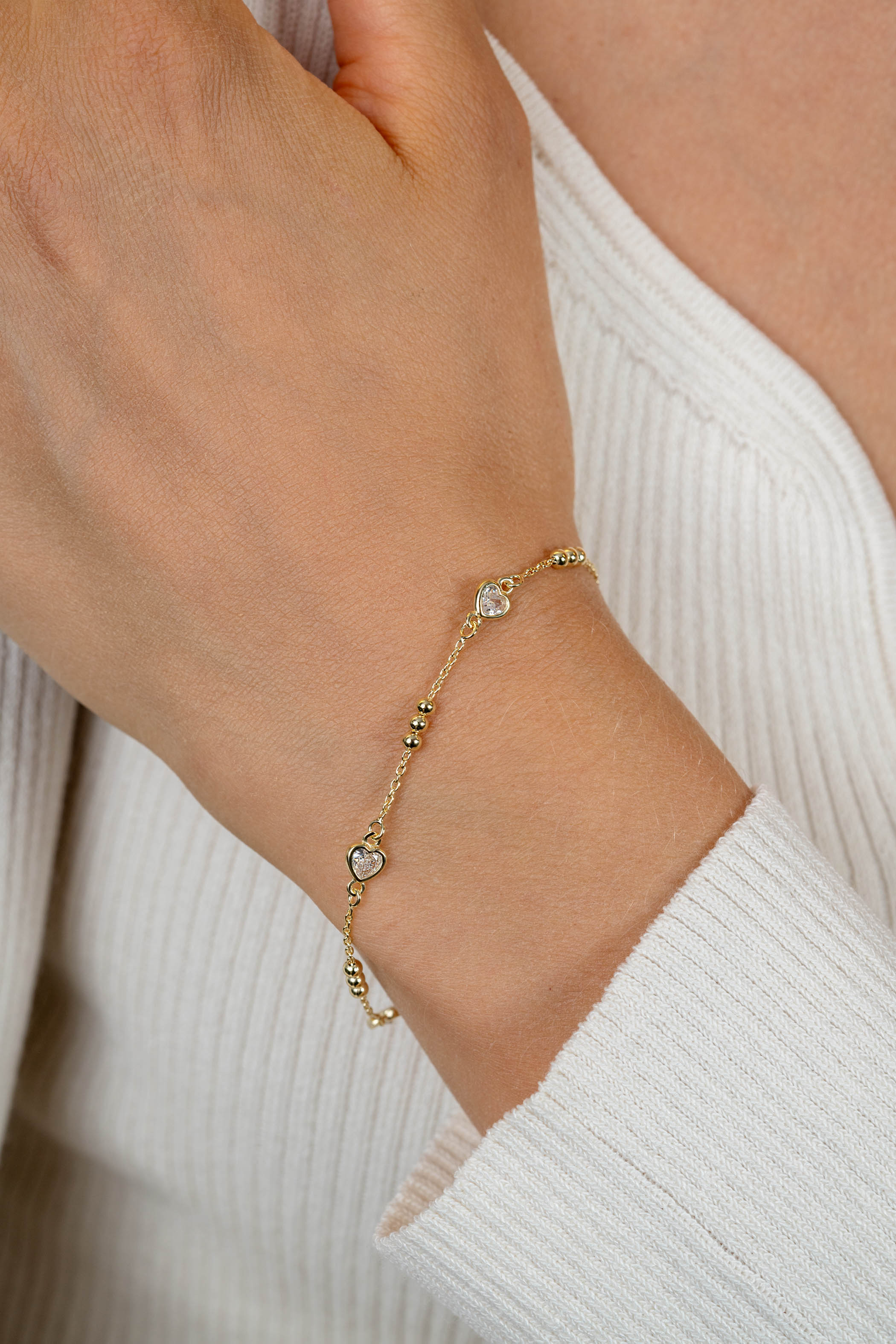 ZINZI gold plated zilveren schakelarmband met trio-bolletjes en drie hartvormige zirkonia's 17-20cm ZIA2679