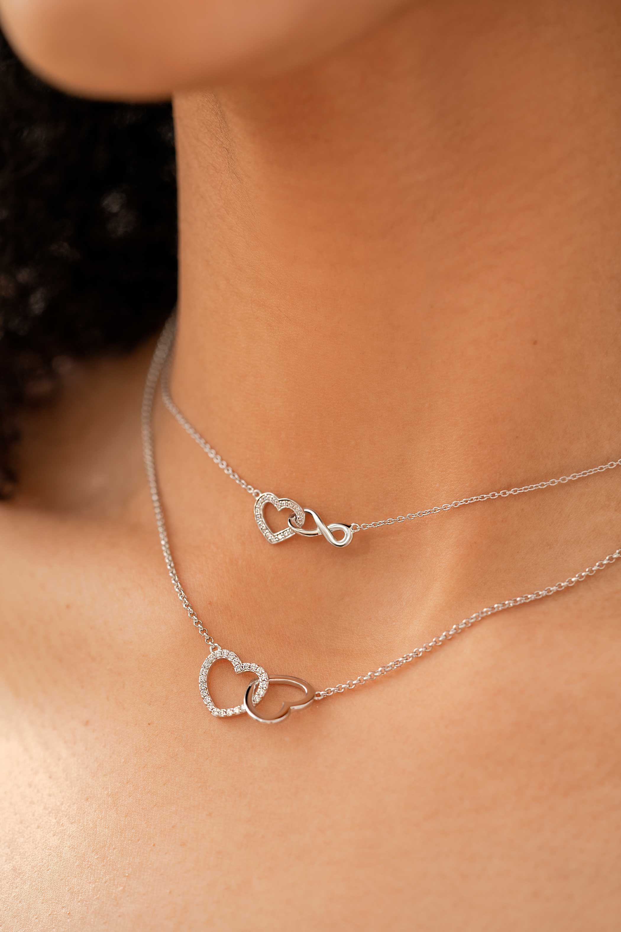 ZINZI zilveren ketting met Infinity teken verbonden met een open hart, bezet met witte zirconia's 42-45cm ZIC2596