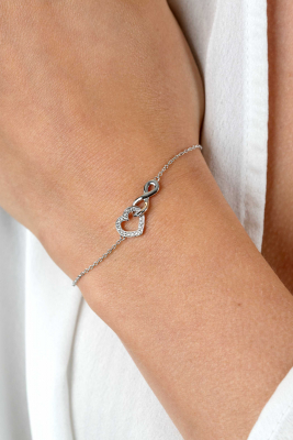 ZINZI zilveren armband met Infinity teken verbonden met een open hart, bezet met witte zirconia's 17-19cm ZIA2596